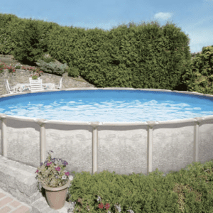 Above-ground PREMIUM POOL - MAGNUS 54" - 7" Resin Top Rail  - SALT FRIENDLY in a garden with stone walls, surrounded by greenery and flowers, sunny day.